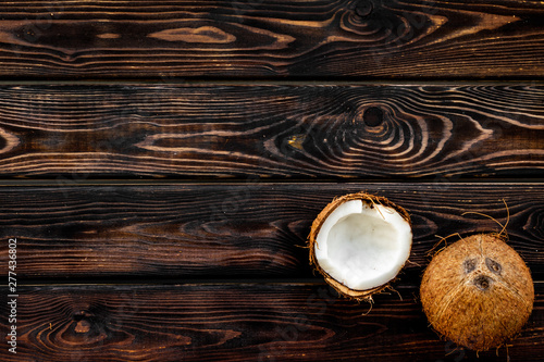 Coconut for cosmetic in body treatment concept on wooden background top view copyspace