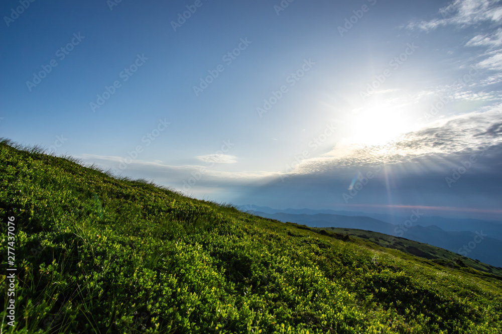 Obraz premium Sunrise in the summer in the mountains