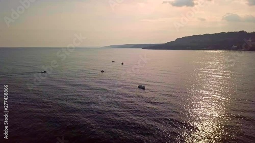 Flying over sea and boats