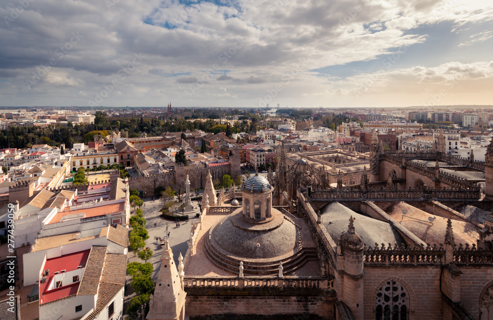 Seville, Spain. Magnificent aerial view of the city. Cloudy blue and golden sky