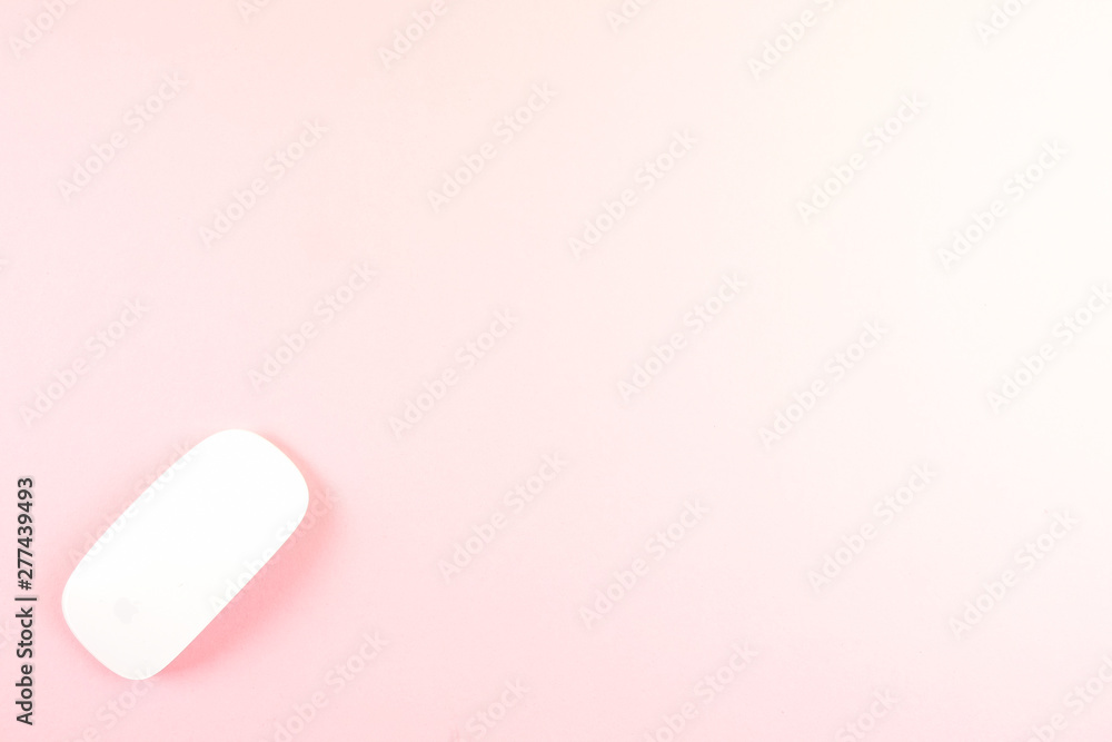 White laptop mouse over pink background. White laptop mouse over pink background.