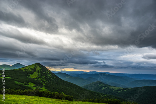 Rain clouds in the evening over the mountains