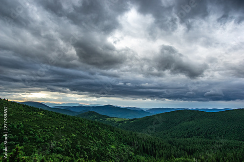 Rain clouds in the evening over the mountains