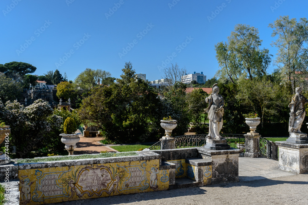 Oeiras, Lisboa PORTUGAL - 10 March 2019 - Garden perspective of the Marquis of Pombal Palace, with old tiles and decorative statues