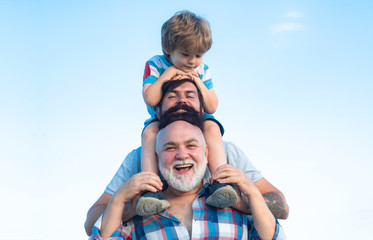 Happy man family have fun together. Fathers day - grandfather, father and son are hugging and having fun together.