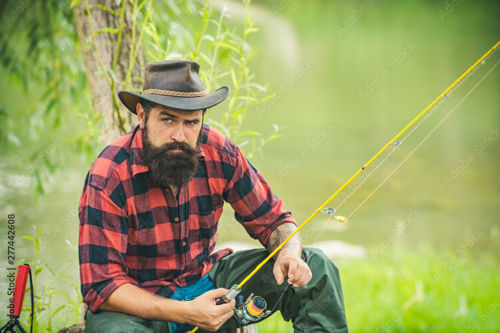 Trout on a hook. Man fly fishing. Brown trout being caught in fishing net. Fly fisherman using fly fishing rod in beautiful river. Catch fish. Trout on a hook. Man fly fishing. Brown trout being caught in fishing net. Fly fisherman using fly fishing rod in beautiful river. Catch fish.