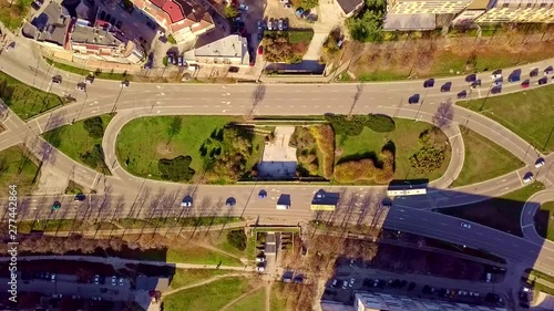 Top aerial view of traffic on elliptical road
