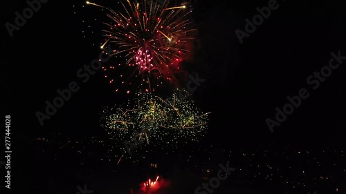 Fireworks at Night Over Small Town