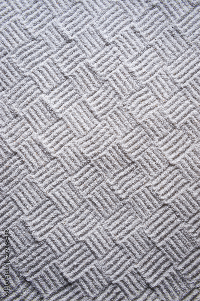Woven cross-hatch pattern hand-raked into an abstract textured background in the monochrome white sand gravel of a Japanese Zen garden Woven cross-hatch pattern hand-raked into an abstract textured background in the monochrome white sand gravel of a Japanese Zen garden