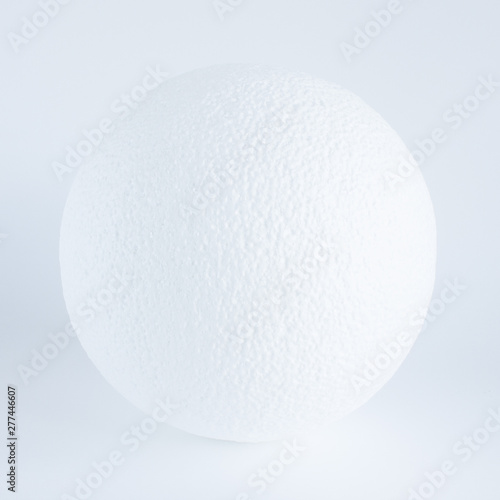 Textured white ball on a white background