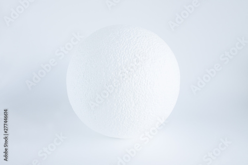 Textured white ball on a white background