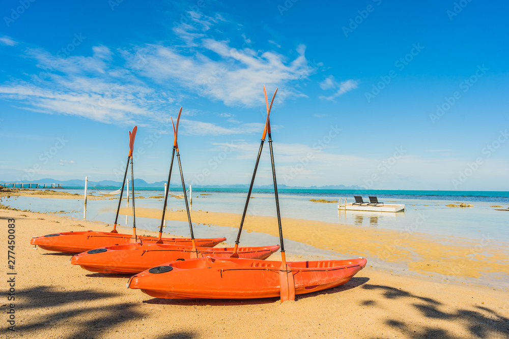 Empty kayak boat or ship on the tropical beach and sea Empty kayak boat or ship on the tropical beach and sea