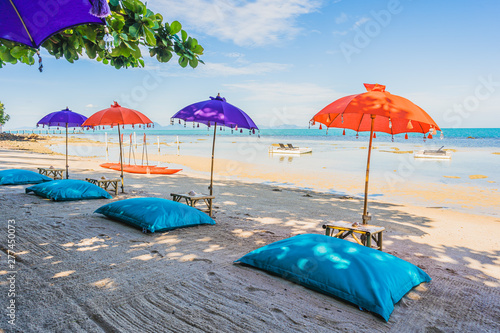 Umbrella around Beautiful beach sea ocean for holiday vacation travel