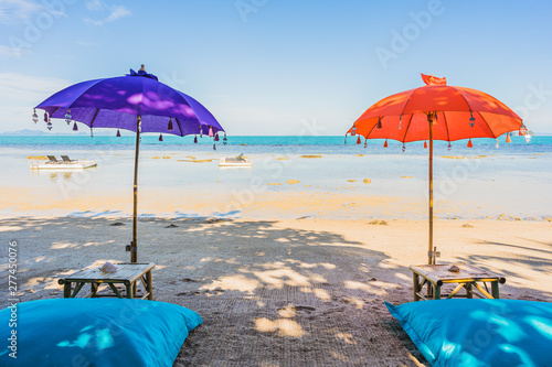 Umbrella around Beautiful beach sea ocean for holiday vacation travel