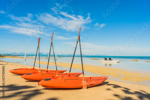 Empty kayak boat or ship on the tropical beach and sea