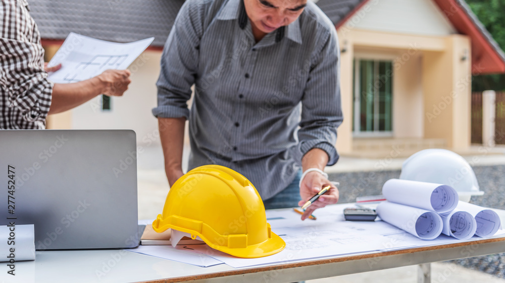 Two business man professional engineer worker at the house building. Two business man professional engineer worker at the house building.