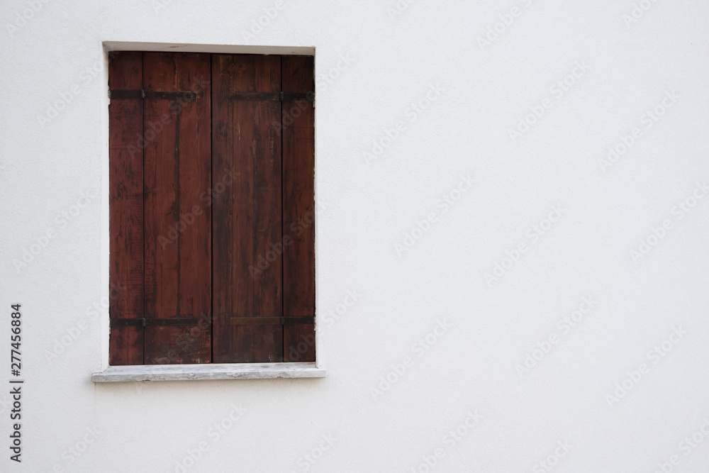 Treviso, Italy, 06/23/2019, Windows on old farmhouse in Treviso prefecture in Italy.
