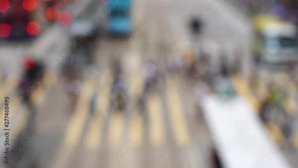 Blurred crowd of people on Hong Kong busy crosswalk; Slow Motion Blurred crowd of people on Hong Kong busy crosswalk; Slow Motion