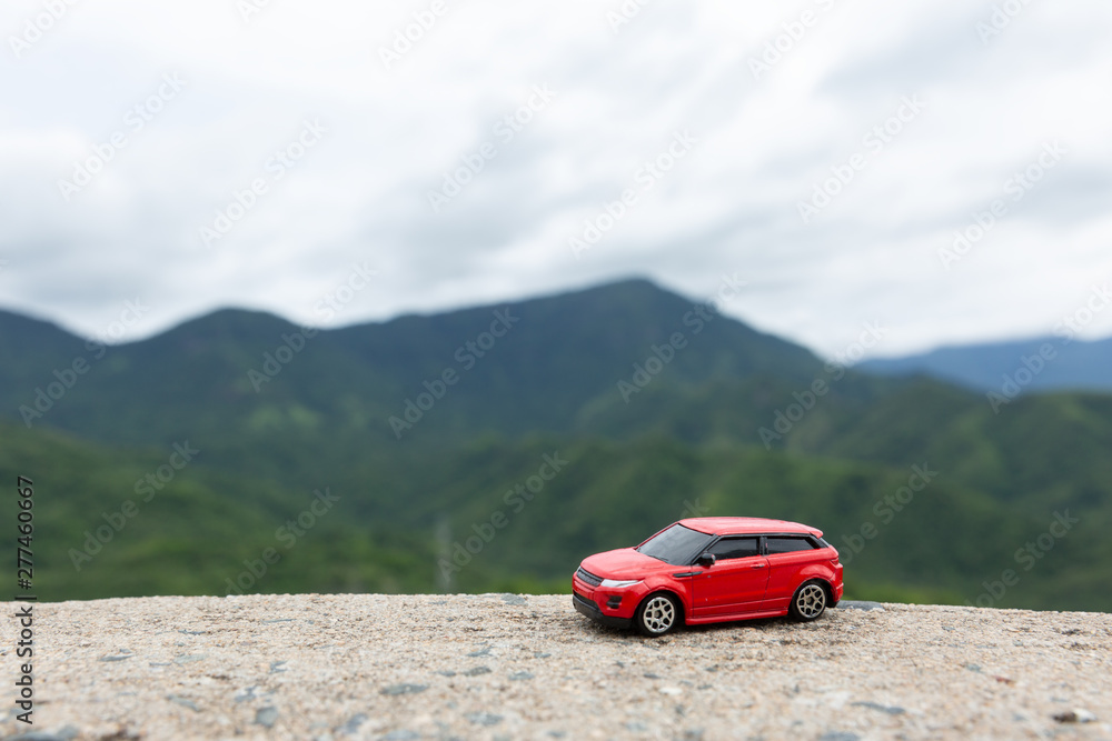 red car with mountain background.Travel concept.