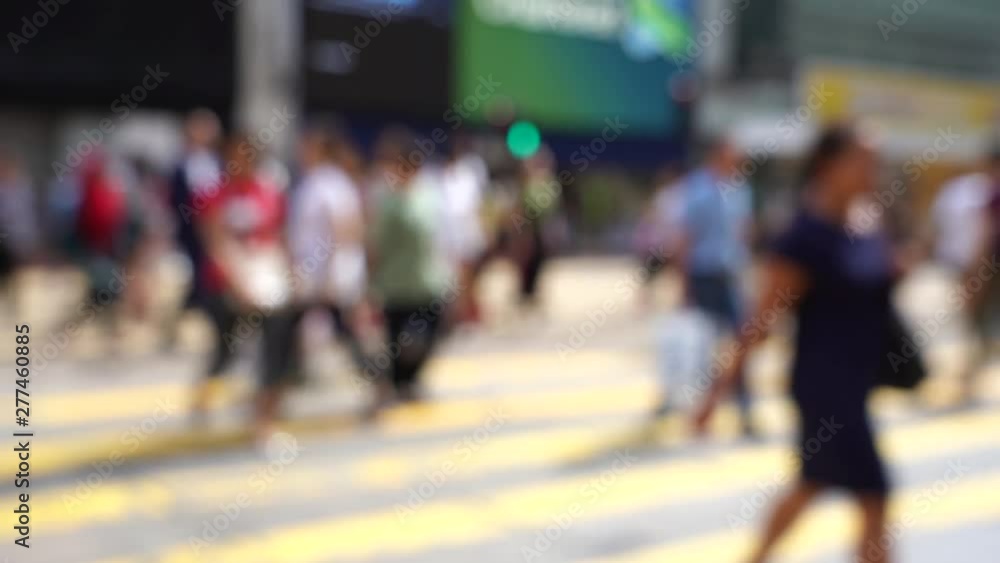 Blurred crowd of people on Hong Kong busy crosswalk; Slow Motion Blurred crowd of people on Hong Kong busy crosswalk; Slow Motion