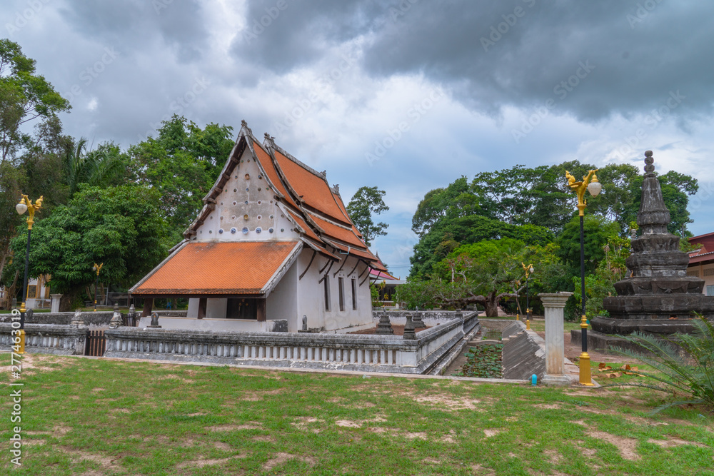 white cloud in blue sky above the old church of wat Ban Lang temple in Rayong province Thailand. the old church was built in Ayutthaya period white cloud in blue sky above the old church of wat Ban Lang temple in Rayong province Thailand. the old church was built in Ayutthaya period
