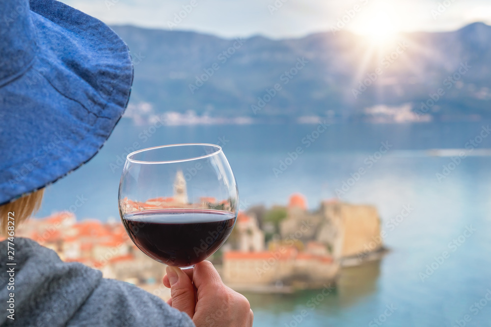 Caucasian woman drinking red wine in summer