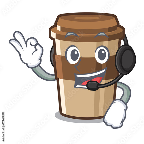 With headphone espresso is placed above mascot table