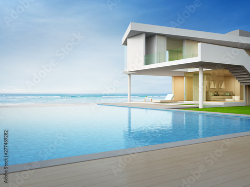Luxury beach house with sea view swimming pool and terrace in modern design. Empty wooden floor deck at vacation home or hotel. 3d illustration of contemporary holiday villa exterior. © terng99