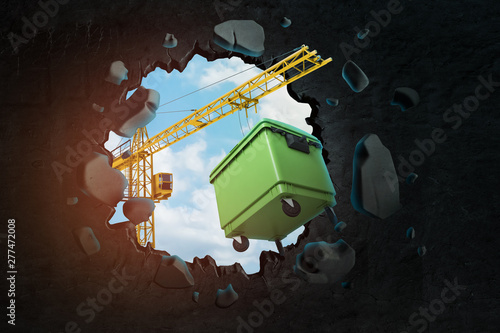 3d rendering of hoisting crane carrying green trash can which is breaking hole in black wall with blue sky seen through.