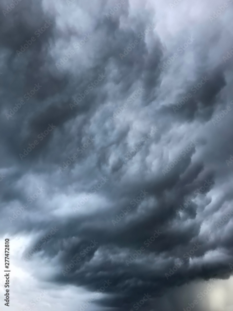 background of heavy dramatic dark clouds background of heavy dramatic dark clouds
