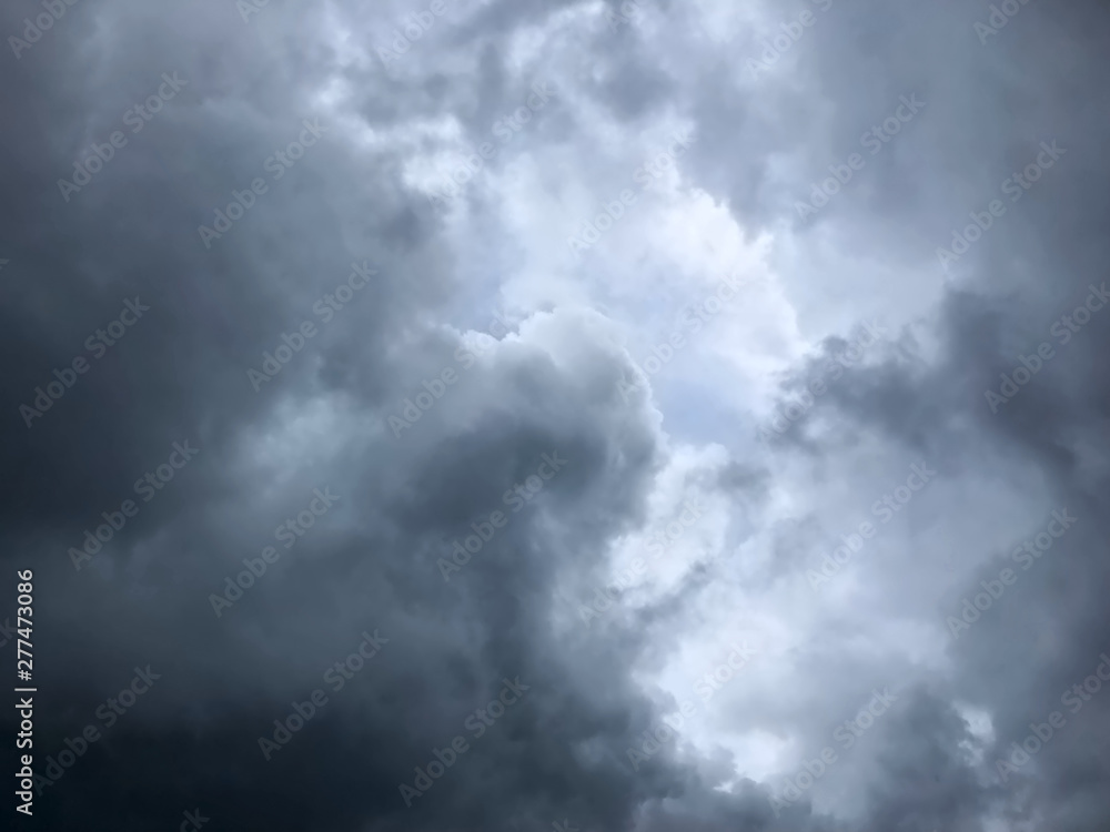 background of dramatic heavy dark clouds on the sky background of dramatic heavy dark clouds on the sky
