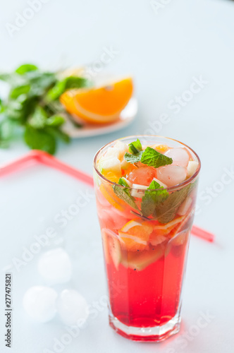 Fresh fruit lemonade with mint in a glass