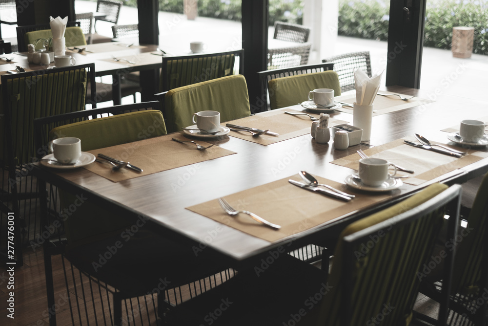 Empty restaurant part of hotel with table and armchair near windows. Empty restaurant part of hotel with table and armchair near windows.