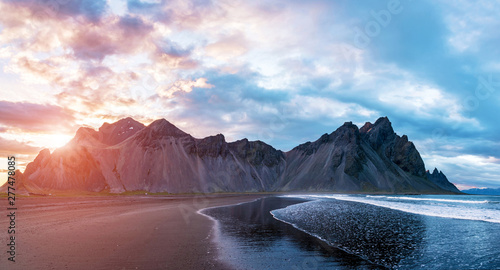 Canvas Print Scenic landscape with most breathtaking mountains Vestrahorn on the Stokksnes peninsula with the waves of the bay at sunset in Iceland
