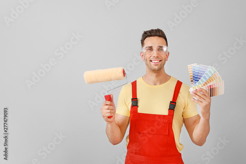 Male painter on light backg...