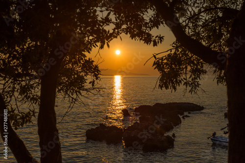 Fototapeta Naklejka Na Ścianę i Meble -  Beautiful sunset with trees and rocks in Dingac Borak, Dalmatia, Croatia, Peljesac peninsula