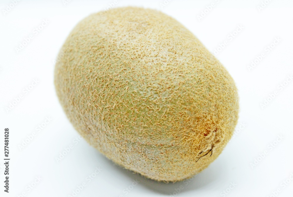 Kiwi is a delicious fruit located on a white background Kiwi is a delicious fruit located on a white background