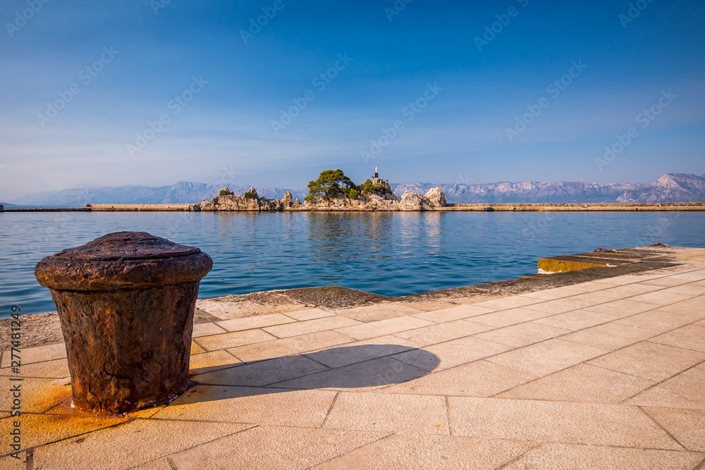 statue in port small vilage Trpanj in Dalmatia, Croatia; Peljesac peninsula statue in port small vilage Trpanj in Dalmatia, Croatia; Peljesac peninsula