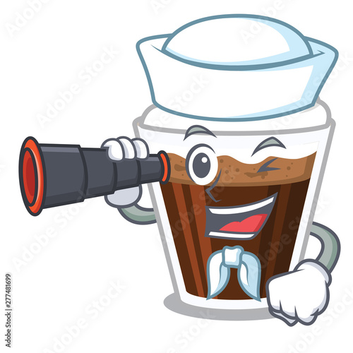 Sailor with binocular Irish coffe above the mascot table