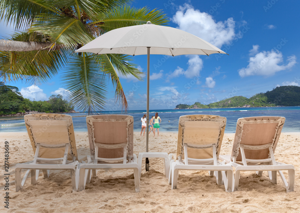 chairs and umbrella on the beach, Seychelles 