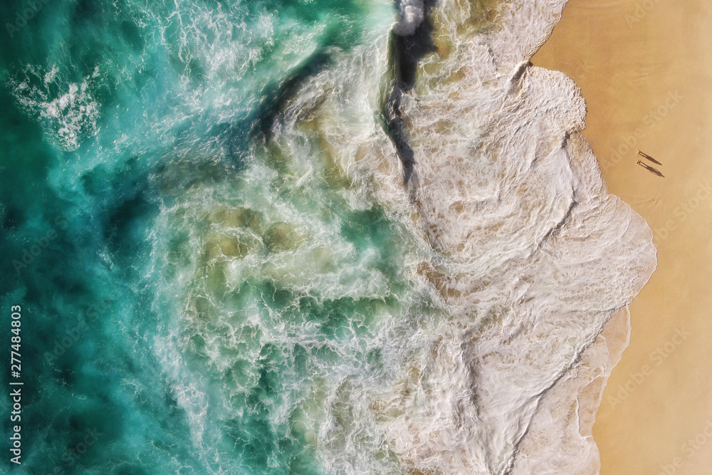 Top Aerial View of Turquoise Ocean Waves Breaking on the Shore of Pristine Tropical Sand Beach, People in Paradise, Summer Holiday and Nature Background Top Aerial View of Turquoise Ocean Waves Breaking on the Shore of Pristine Tropical Sand Beach, People in Paradise, Summer Holiday and Nature Background