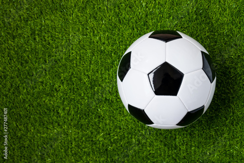 top view of soccer ball on artificial grass feild background