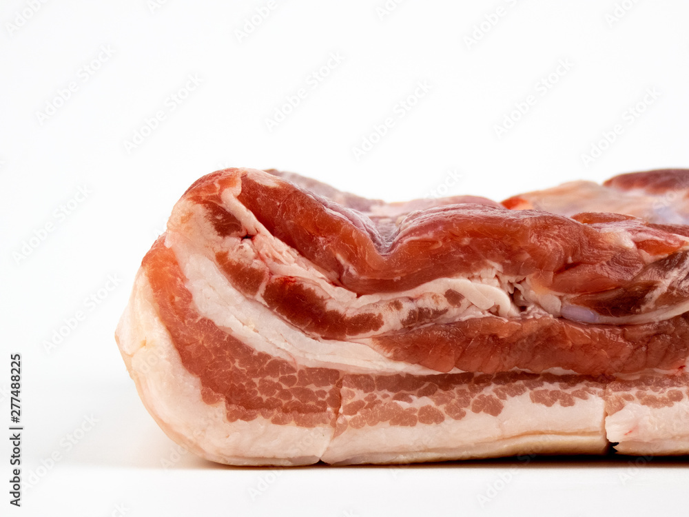 raw pork belly isolated on white copyspace closeup raw pork belly isolated on white copyspace closeup