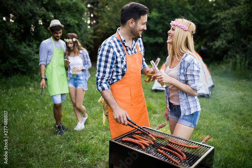 Friends having a barbecue party in nature