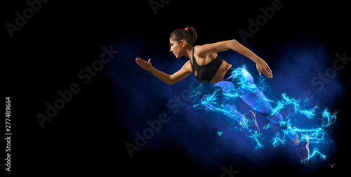 woman running on dark background