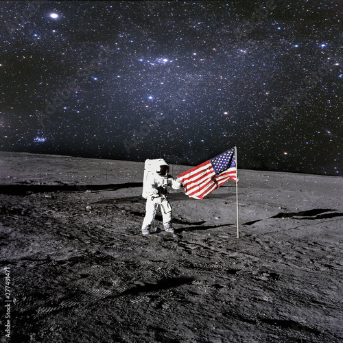 American astronaut landed and set his national flag on the plane.t. Elements of this image furnished by NASA 