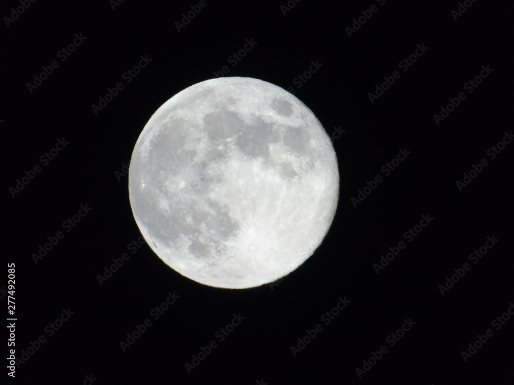 Full Moon Isolated on Black Background in summer days Full Moon Isolated on Black Background in summer days
