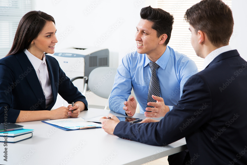Businessman tells his colleagues about a new project Businessman tells his colleagues about a new project