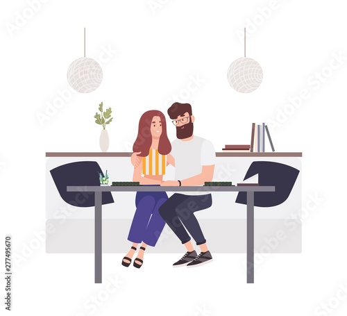 Lovely couple sitting at cafe table and embracing each other. Happy boyfriend...