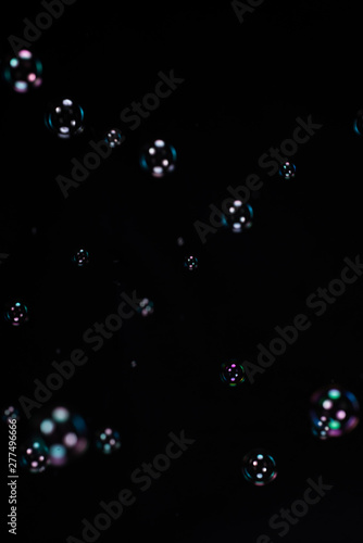 Soap bubbles on black background